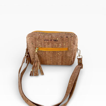 Cork handbag with a strap on a white background